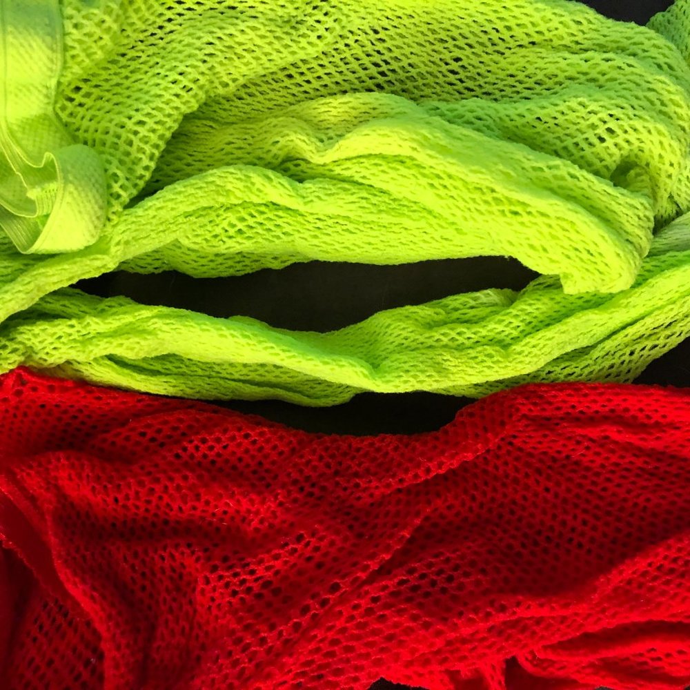 Fishnet tights / fishnets / stockings - one red, one green